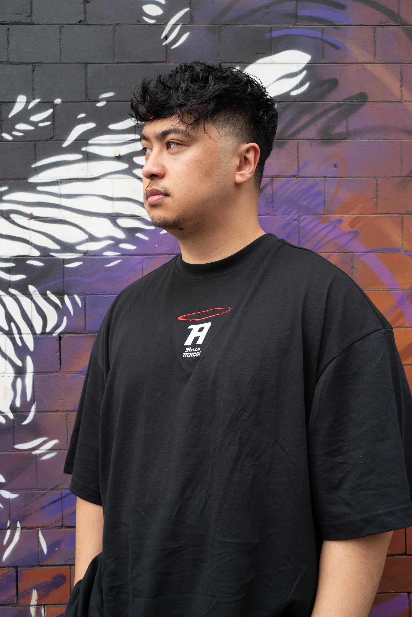 The Follow Up Black Tee